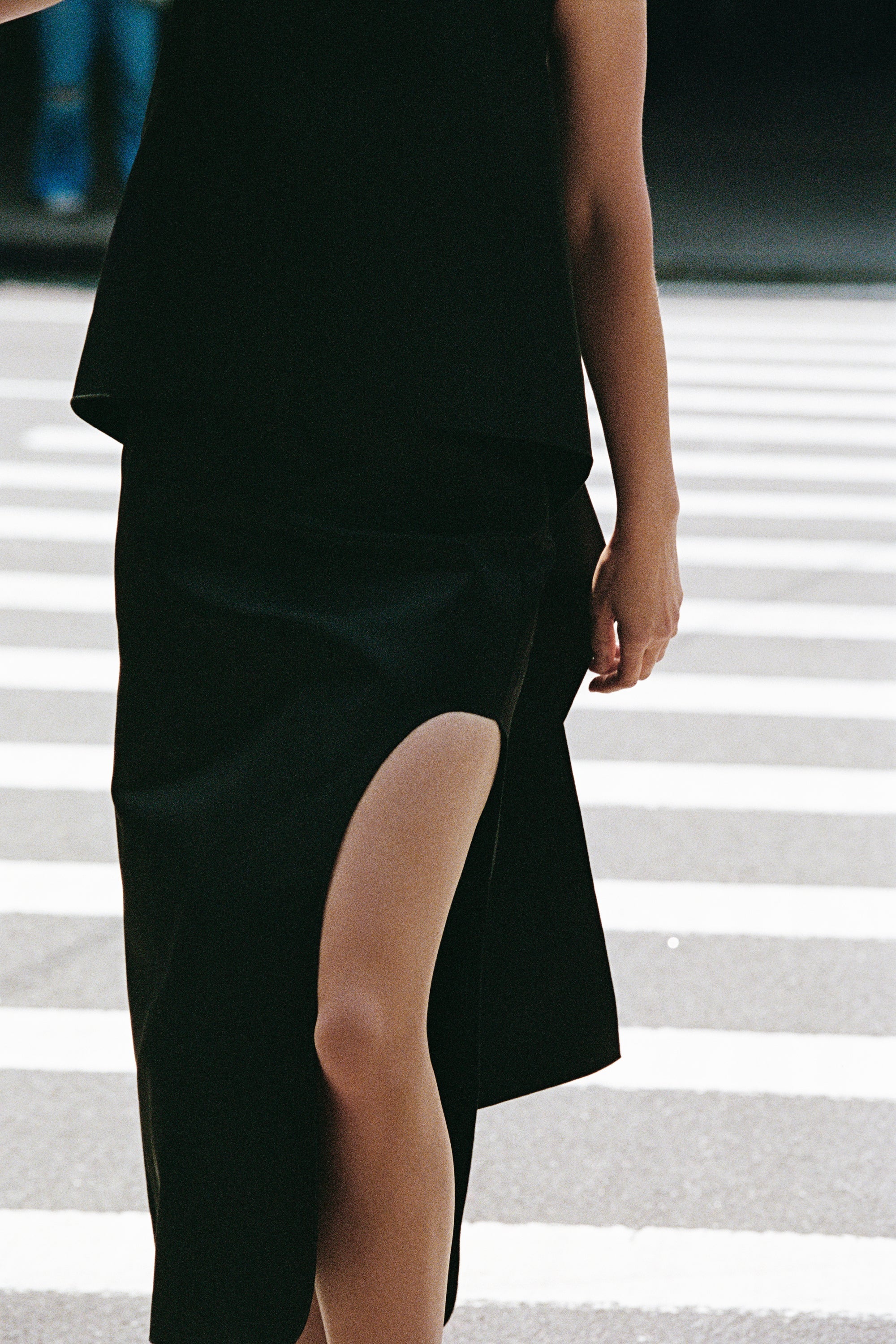 Model walking through the street wearing By Malene Birger.