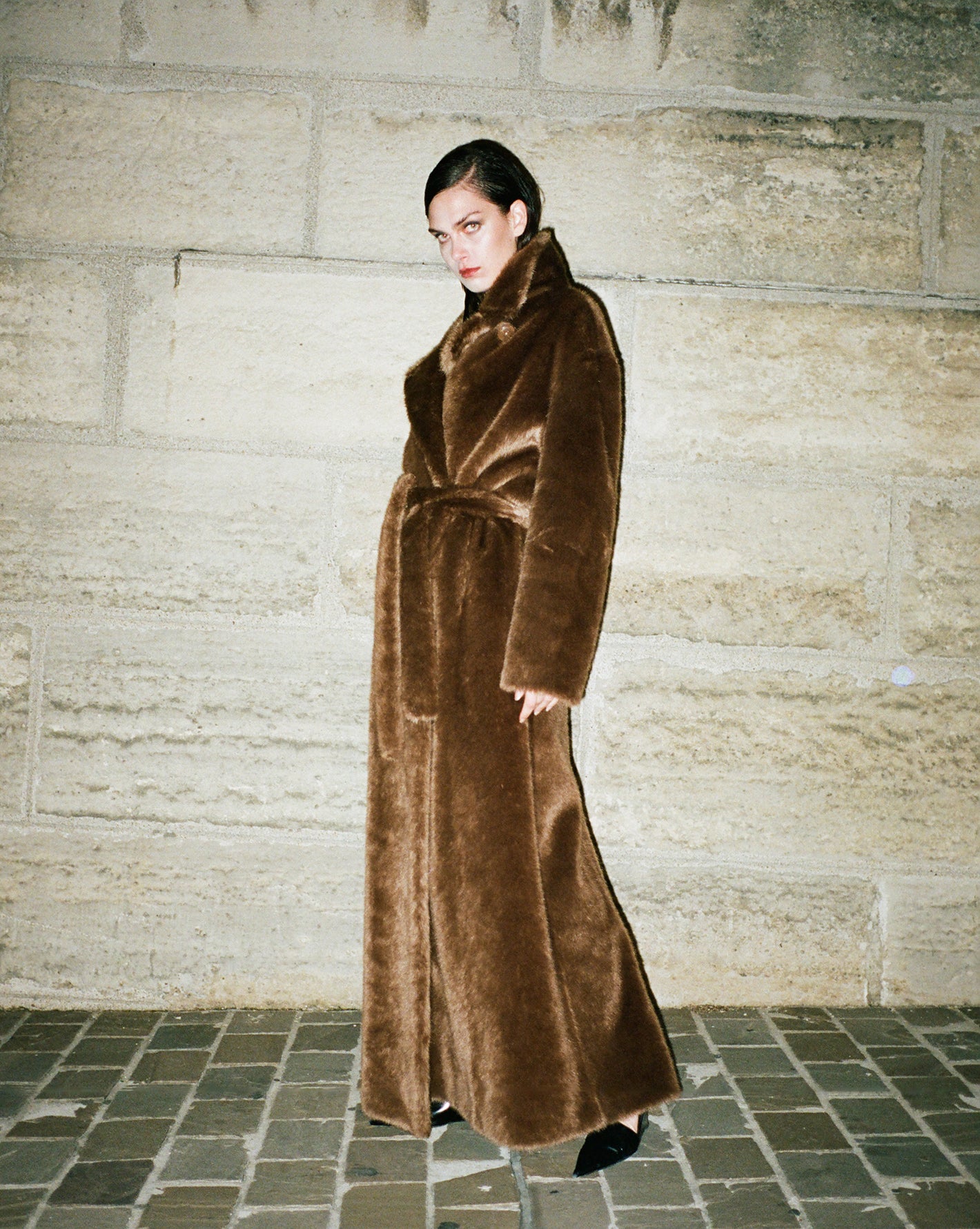Model photographed in the streets of Paris by Diana Bartlett wearing the Frankie Shop Joni faux fur coat. 