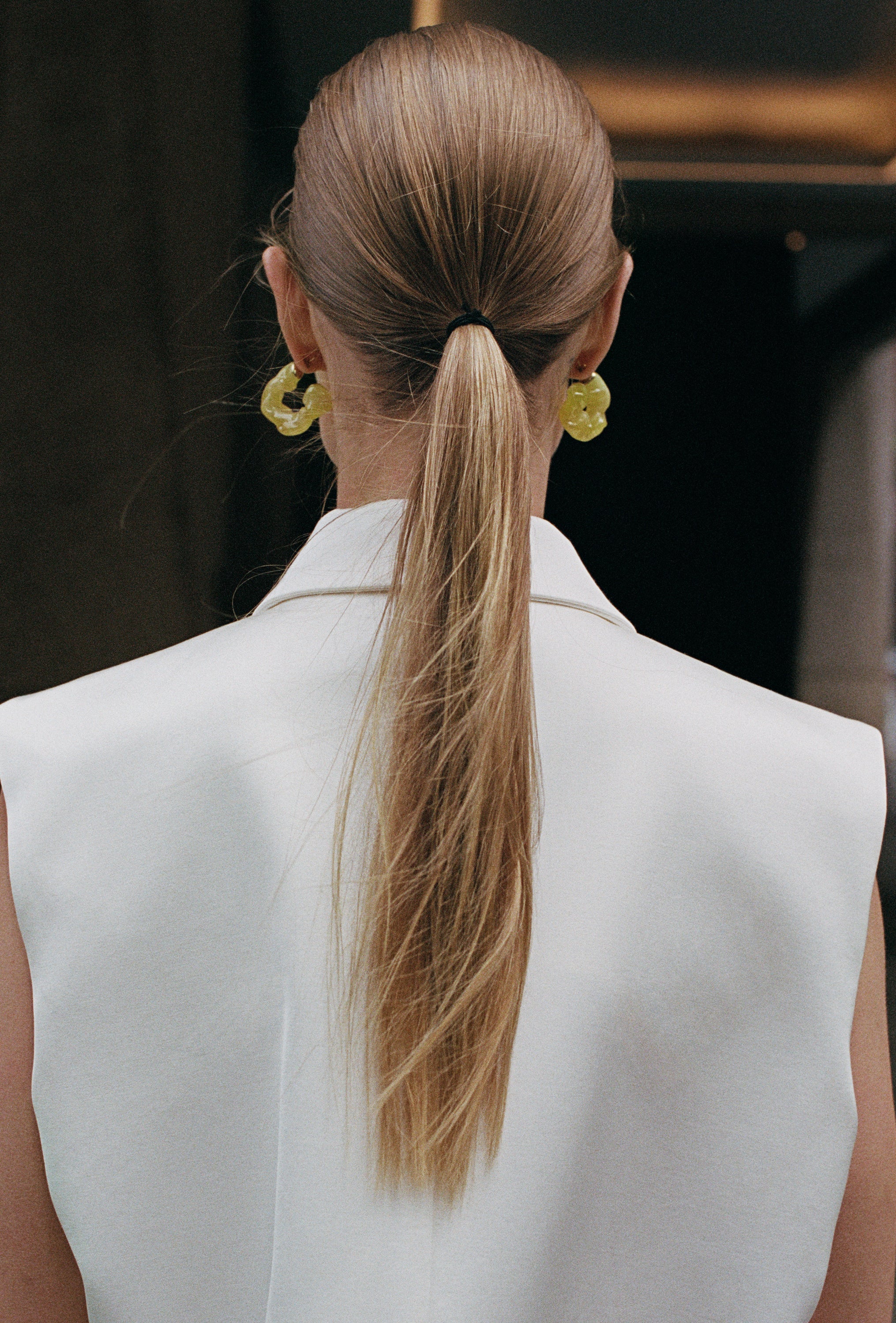 The Frankie Shop model wearing the Everly Satin Vest in white. 