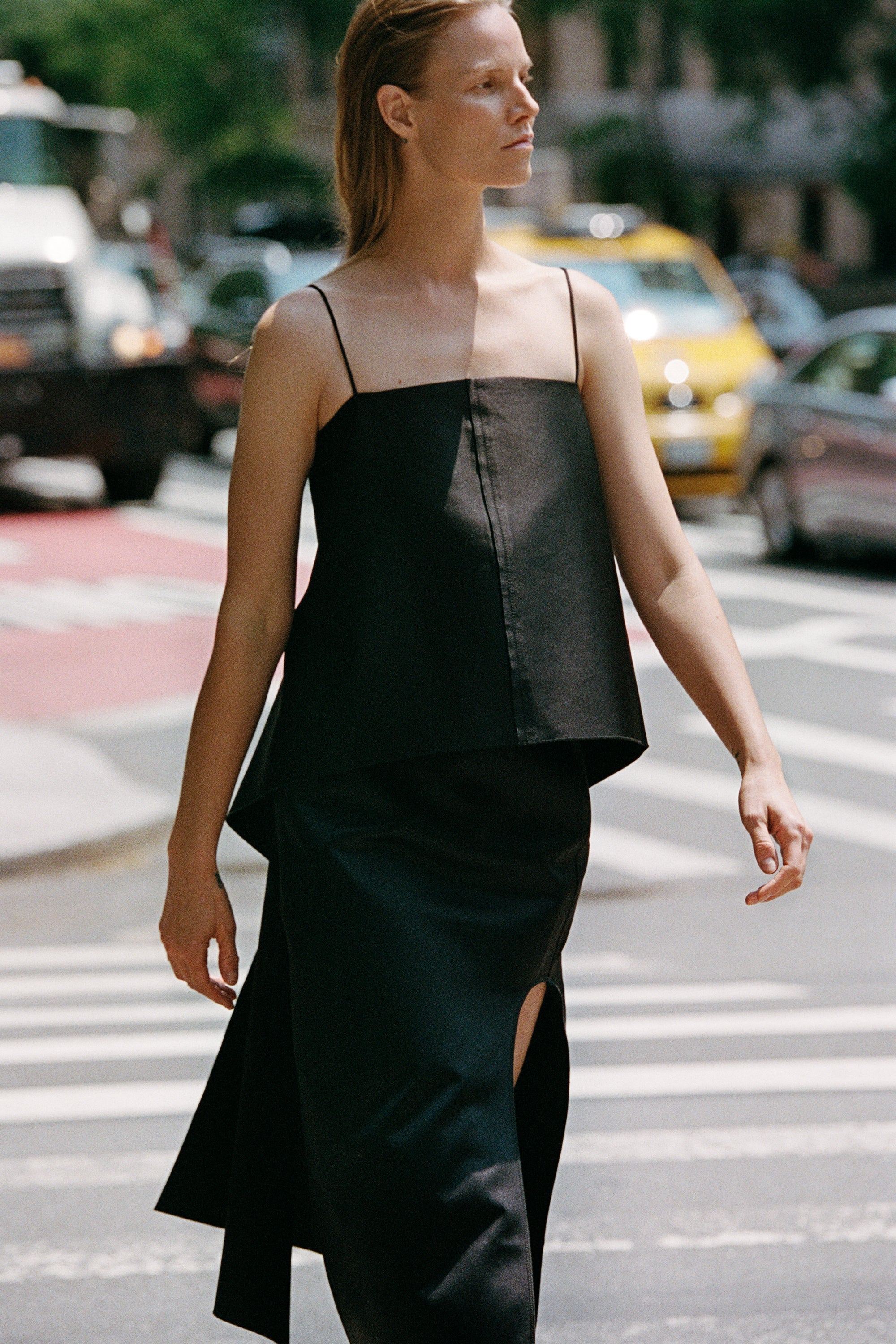 Model walking through the street wearing By Malene Birger.