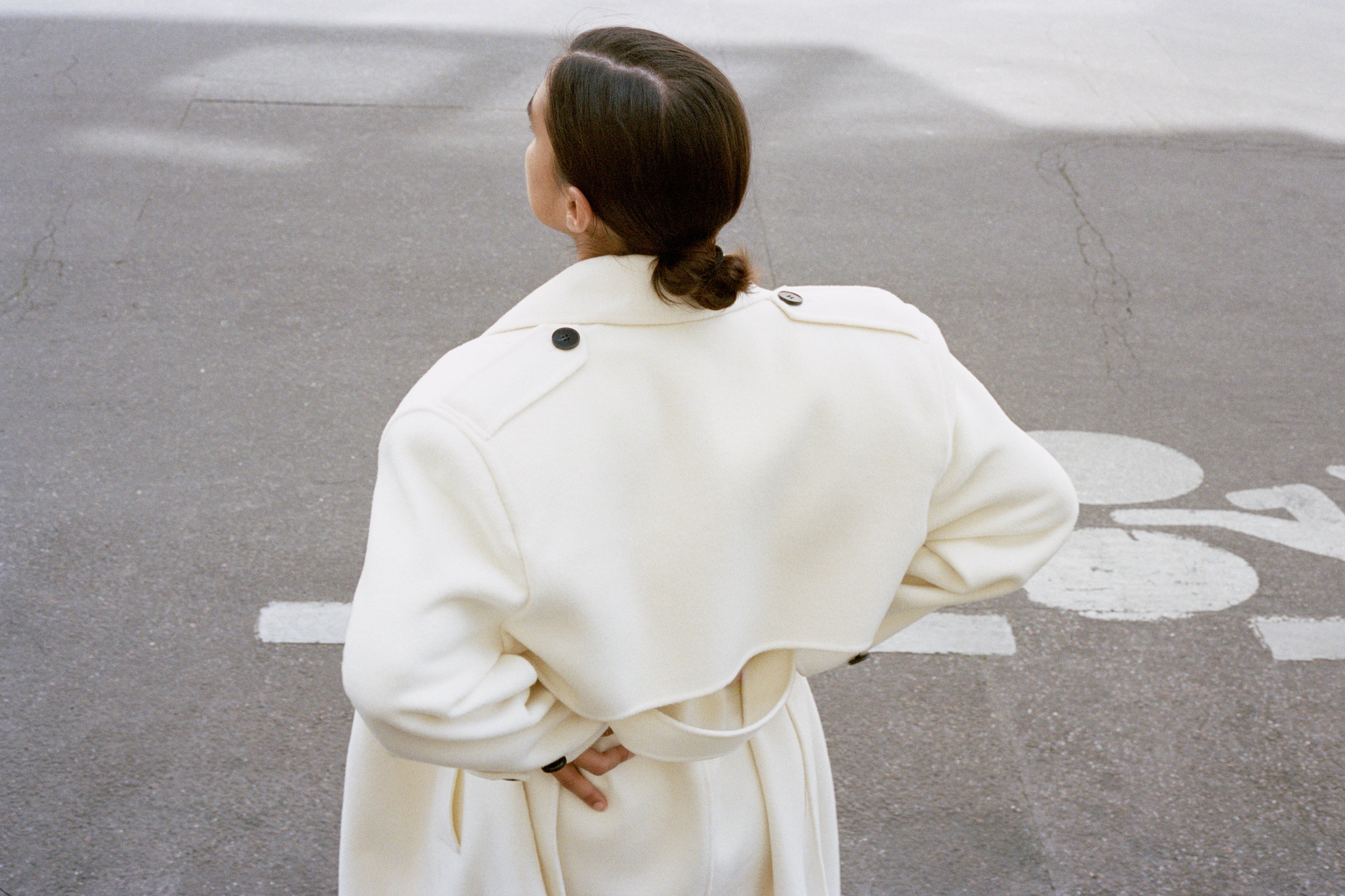 Model Jill Kortleve photographed on street of Paris by Letty Schmiterlow wearing The Frankie Shop white coat.