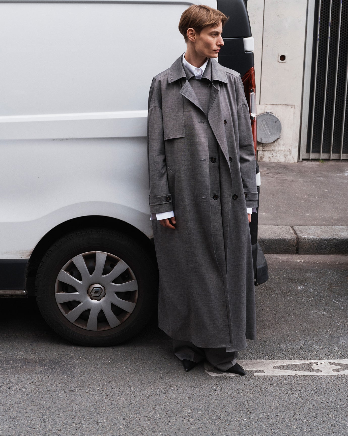 Model Veronika Kunz photographed by Sarah Blais in the streets of Paris wearing The Frankie Shop long grey jacket.  