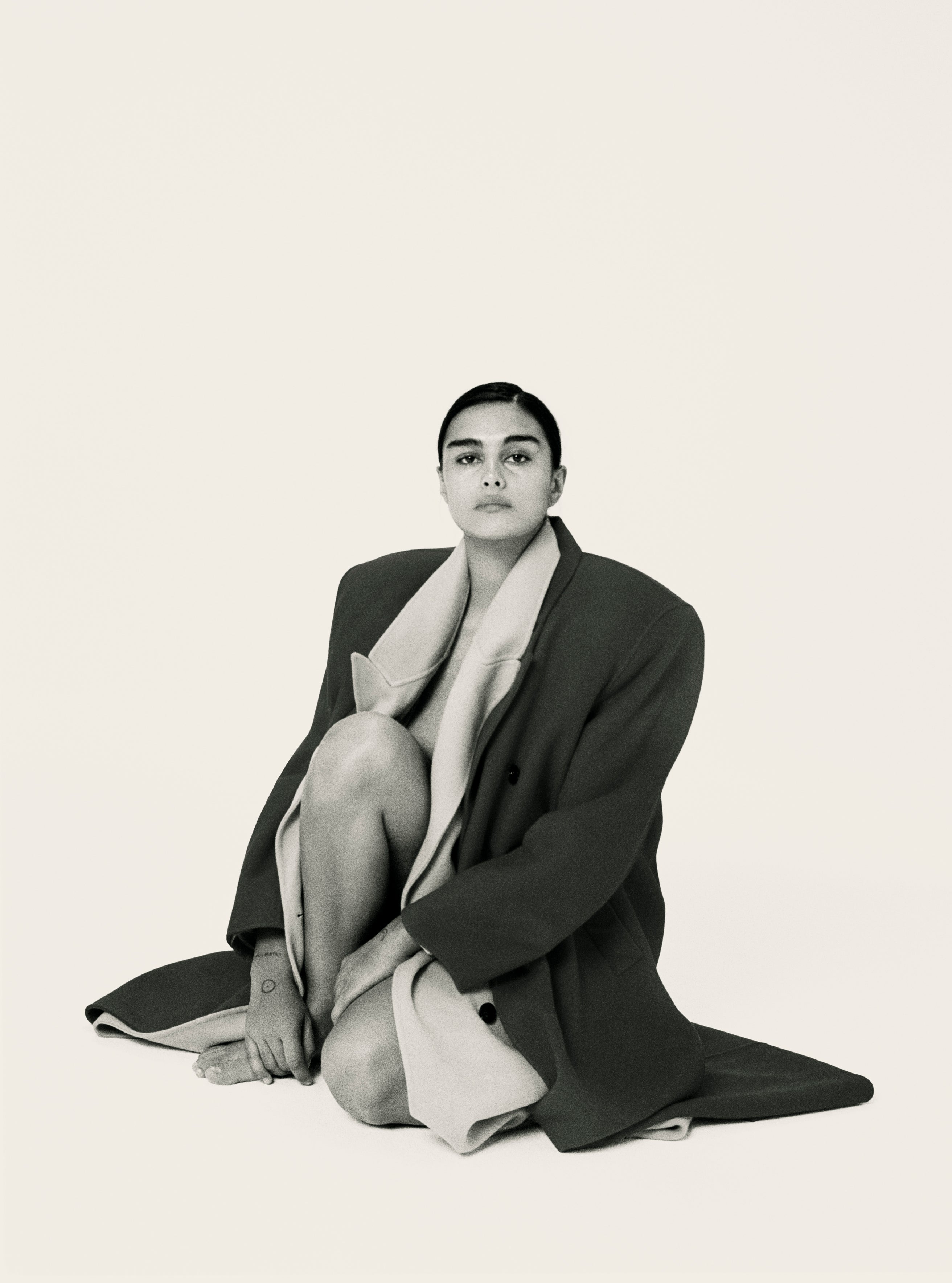 Model Jill Kortleve photographed Letty Schmiterlow wearing two Frankie Shop coats layered over each other. 