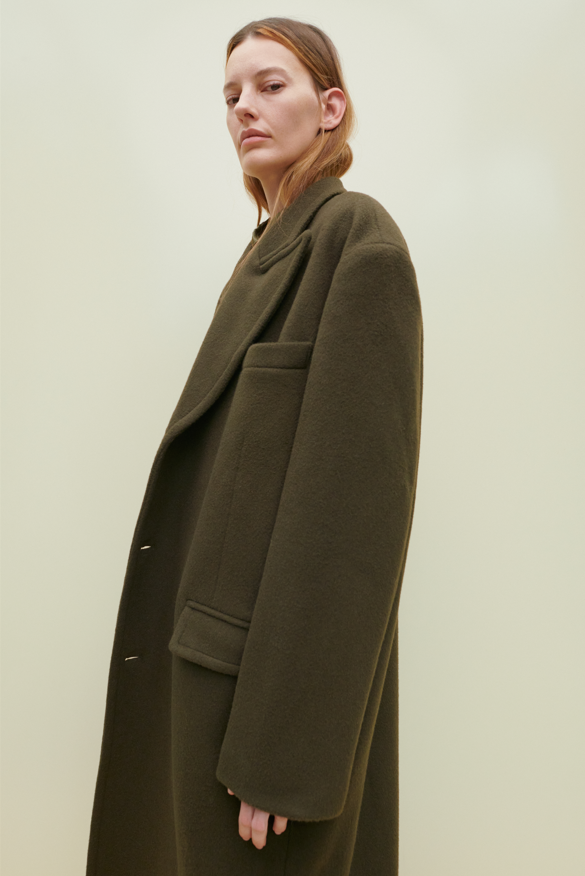 Amanda Murphy captured by Chris Rhodes wearing The Frankie Shop green wool coat. 