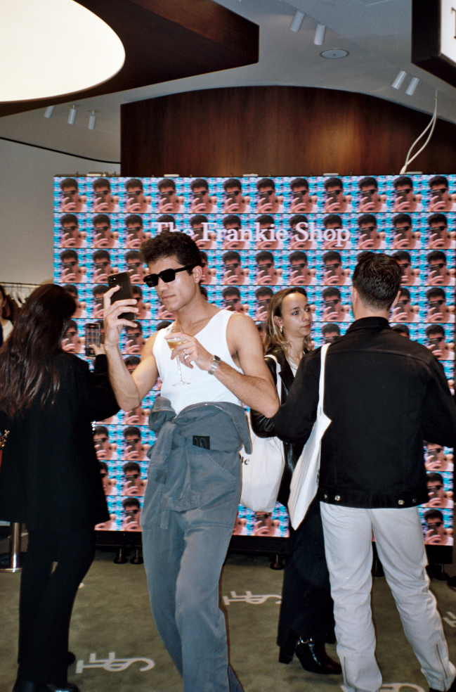 People socialising at The Frankie Shop Galeries Lafayette opening. 