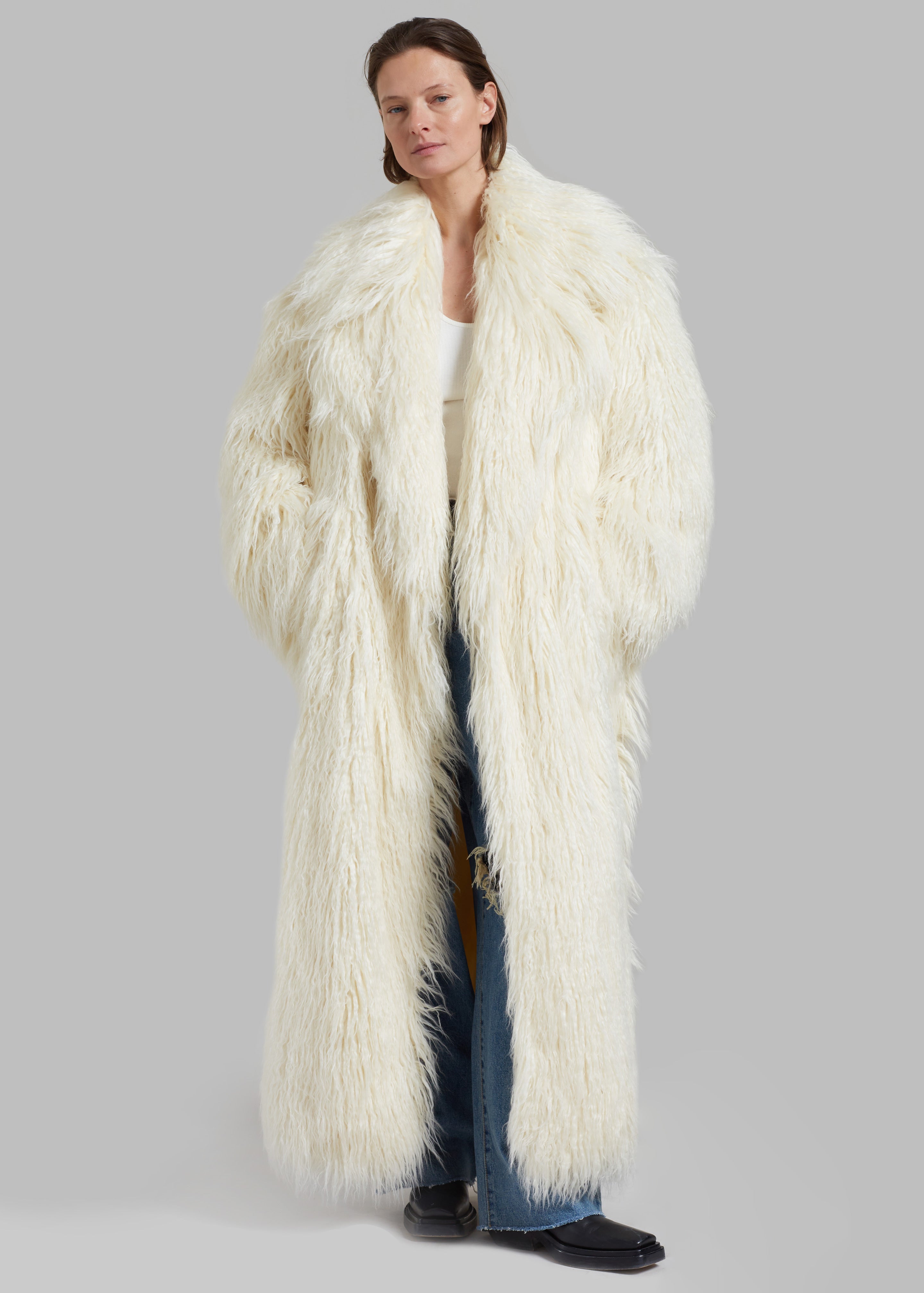 Full length white store faux fur coat