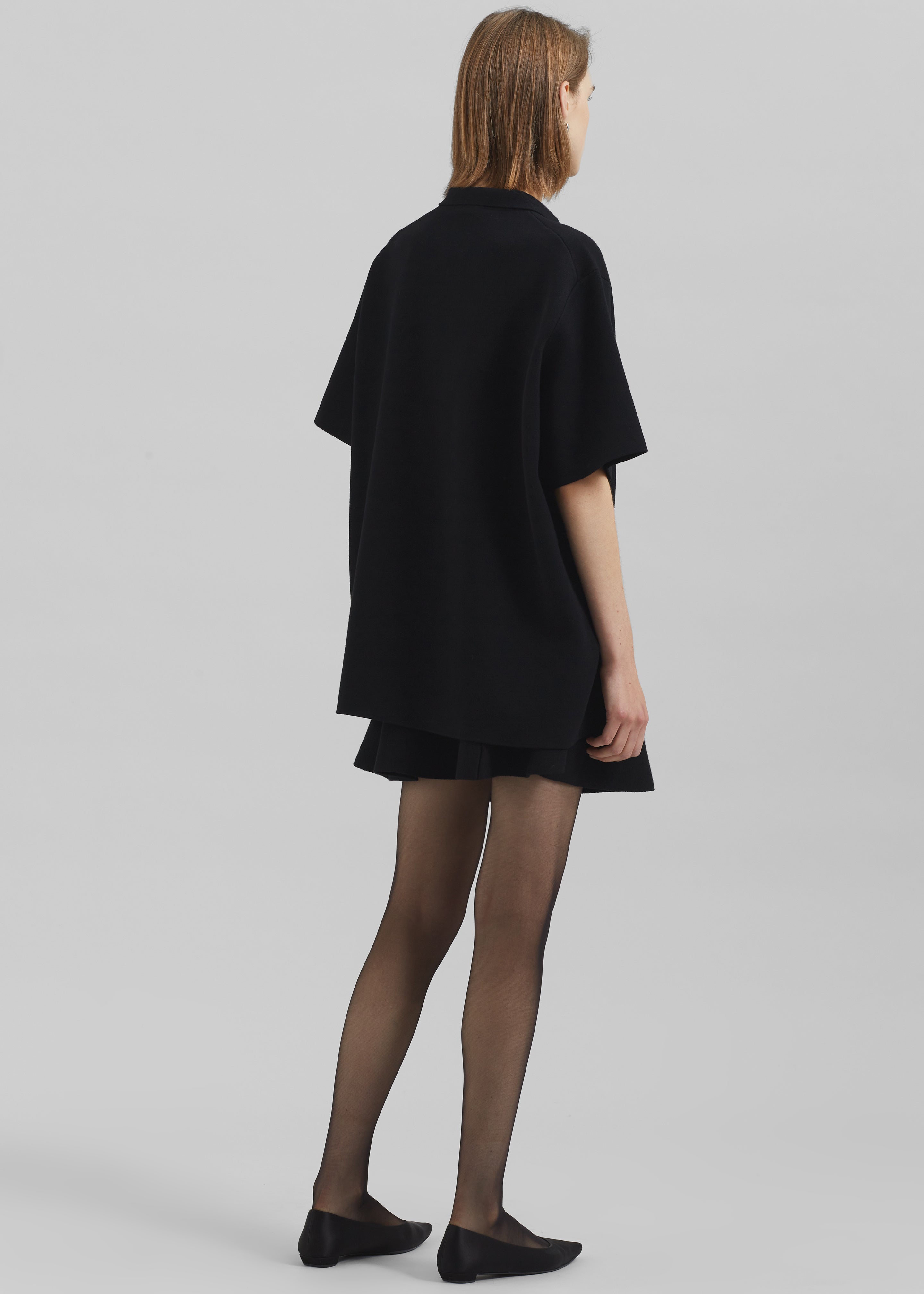 フィオーレトップス/black Riya Zip-Up Polo - Black – The Frankie Shop