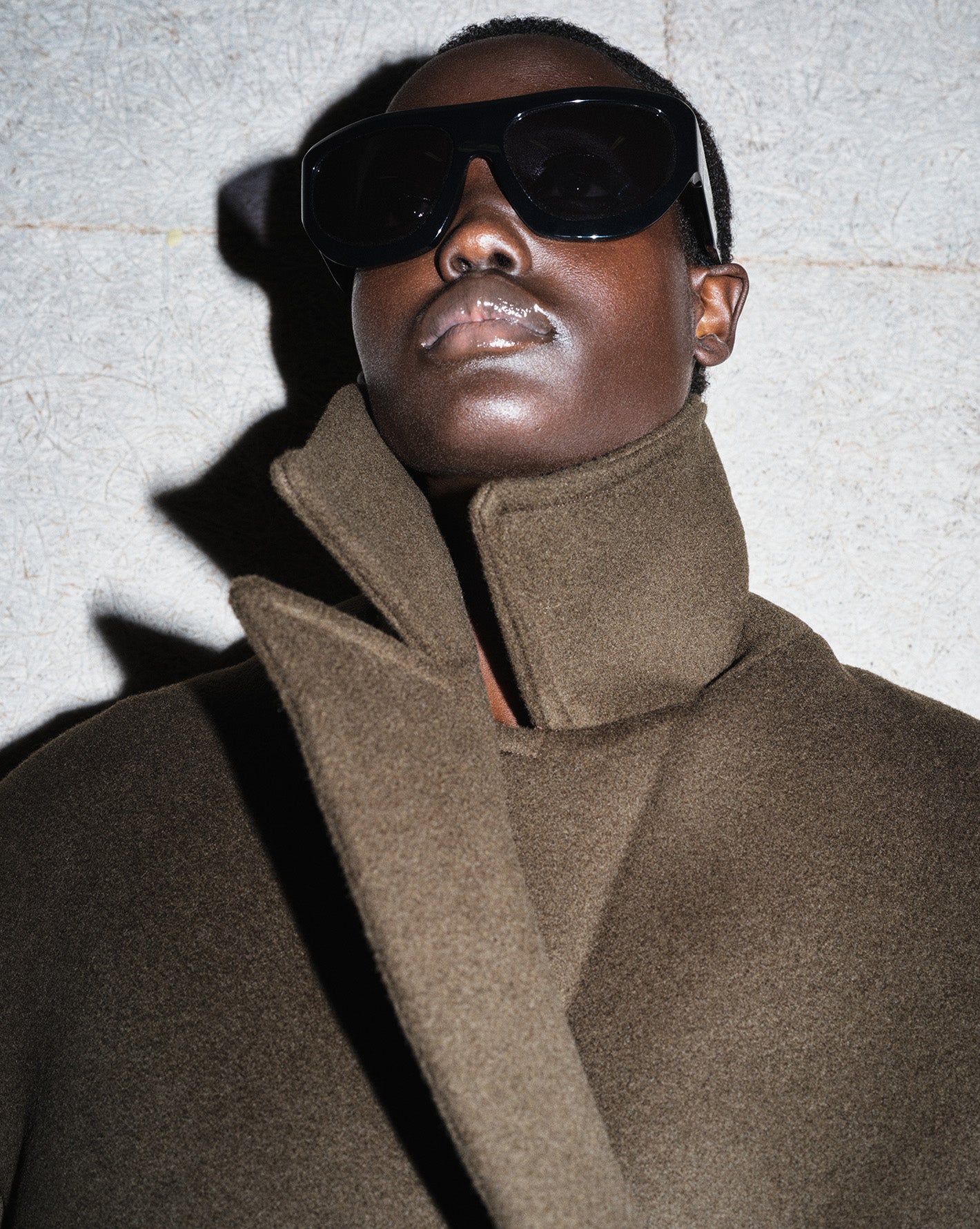 The Frankie Shop Winter editorial from Sarah Blais. Model wearing a brown coat and large sunglasses 