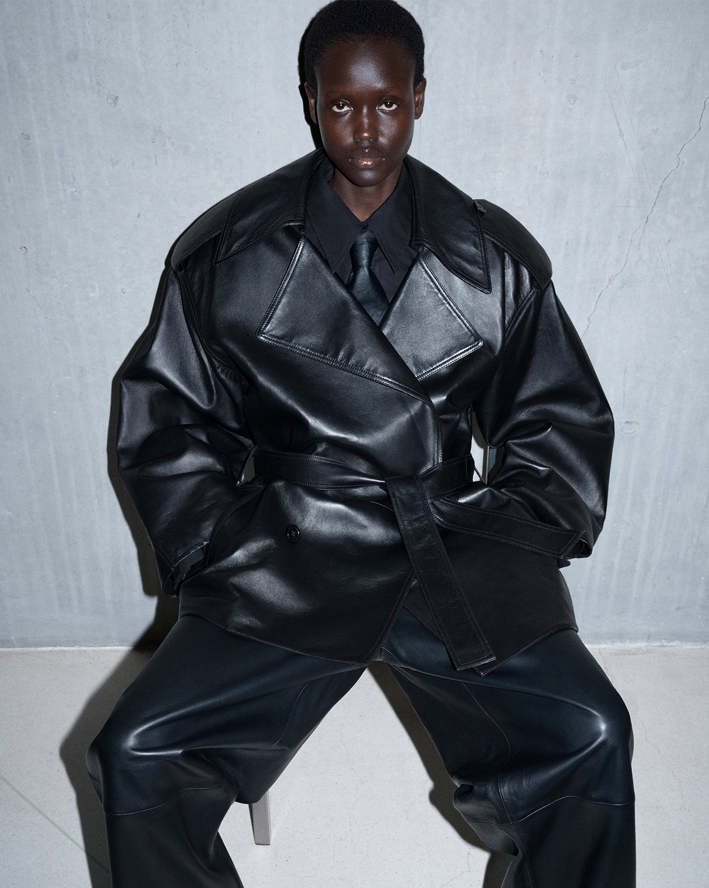 The Frankie Shop model wearing a leather jacket and leather pants 