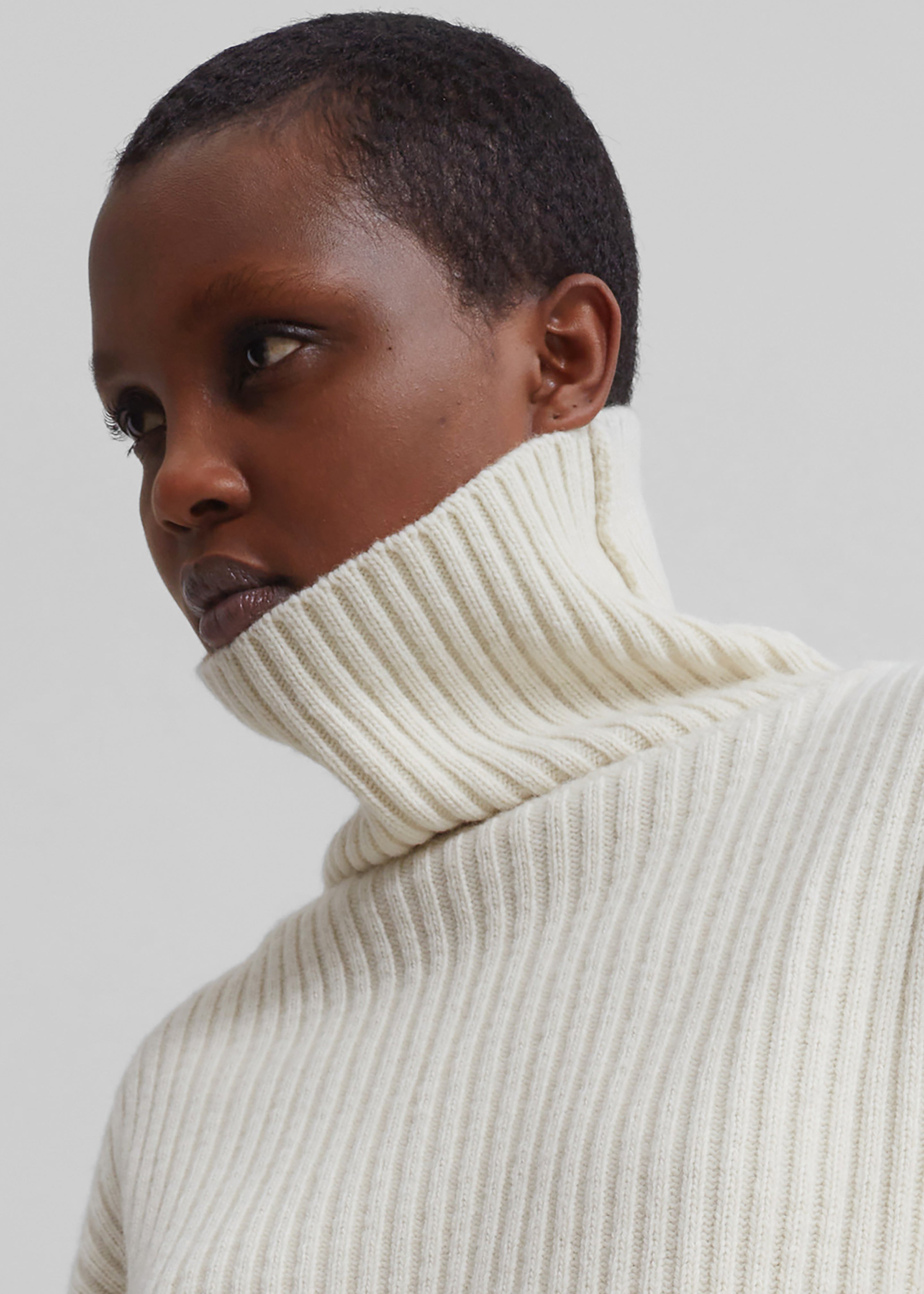 Roll neck jumper clearance cream