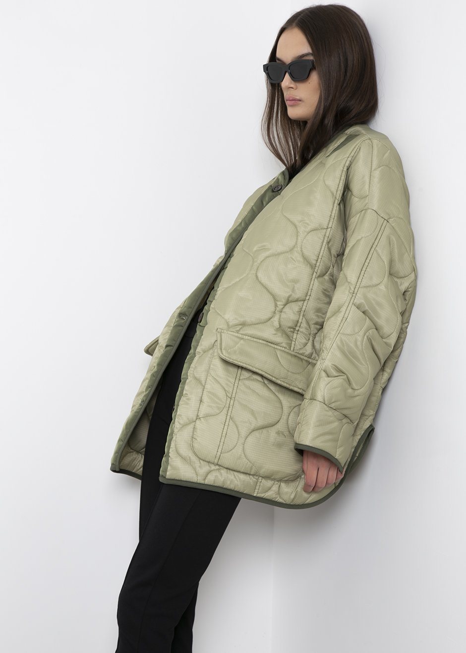 Collarless quilted store coat